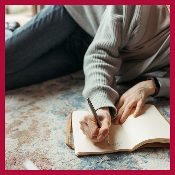 image of a woman journalling 