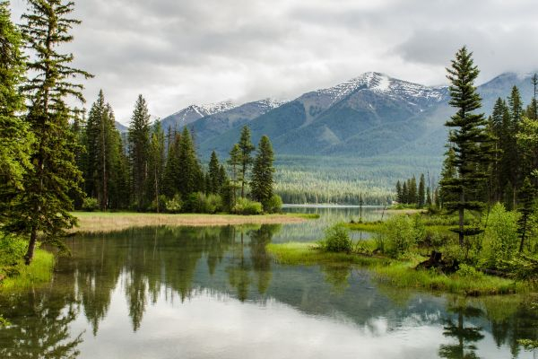 river in valley with mountains