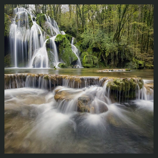 natural water falls and pools in a forest