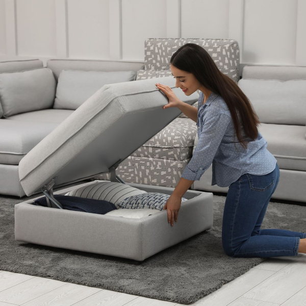 woman opening ottoman