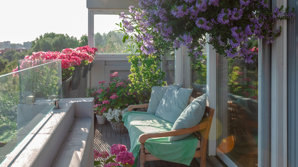 balcony with flowers and couch