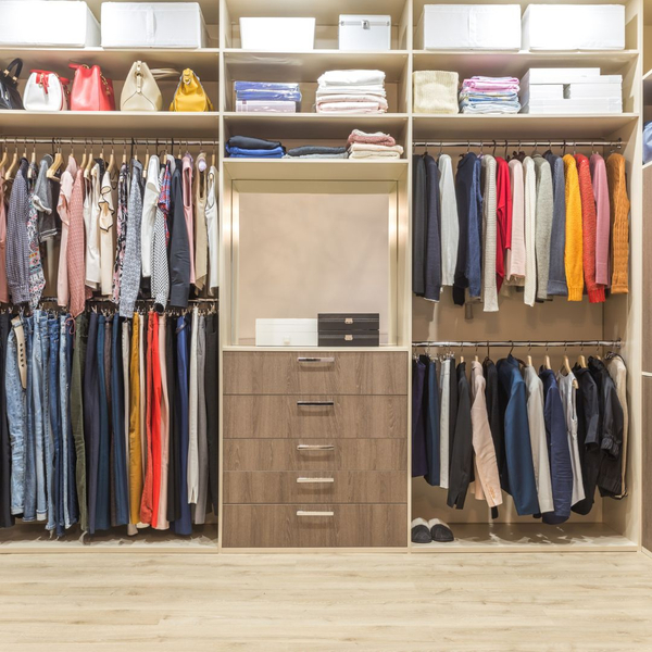 Organized closet area with bins on top