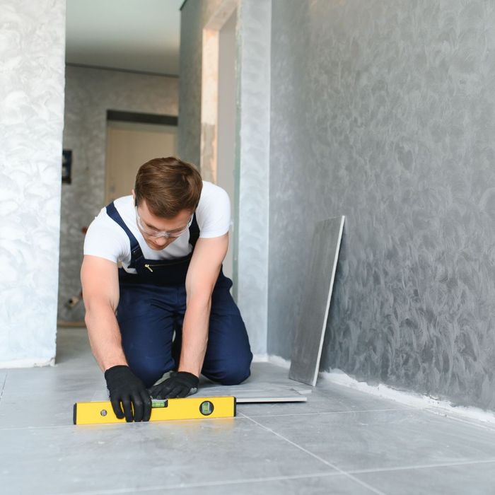 man installing floor