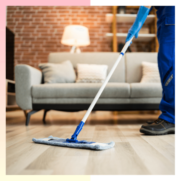 broom sweeping a living room floor arvada3.png