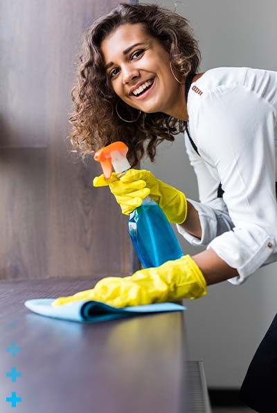 Woman cleaning and smiling