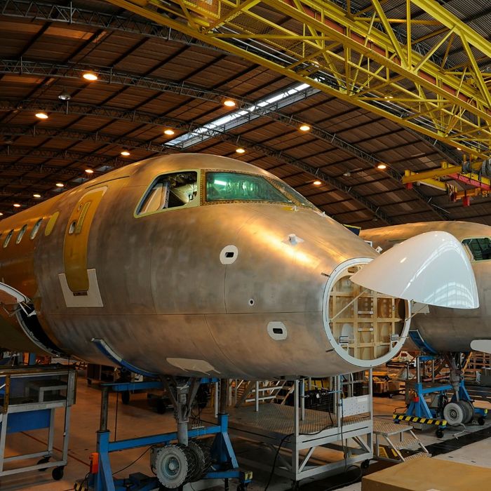 an airplane being constructed in a hanger