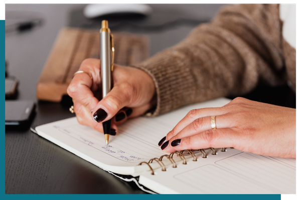 woman writing down questions