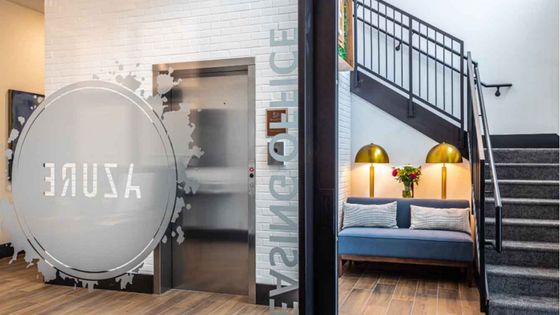 small cozy lounge chair under stairwell