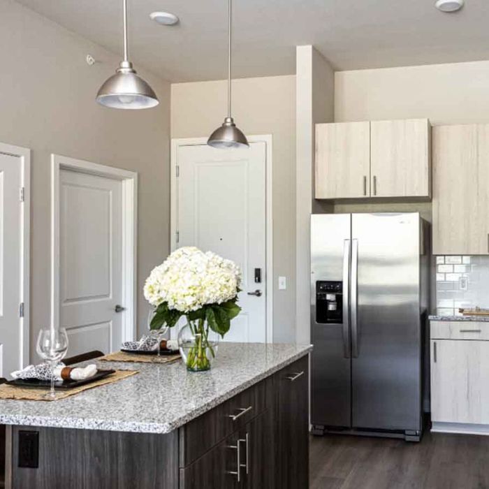 apartment interior with stainless steel refrigerator