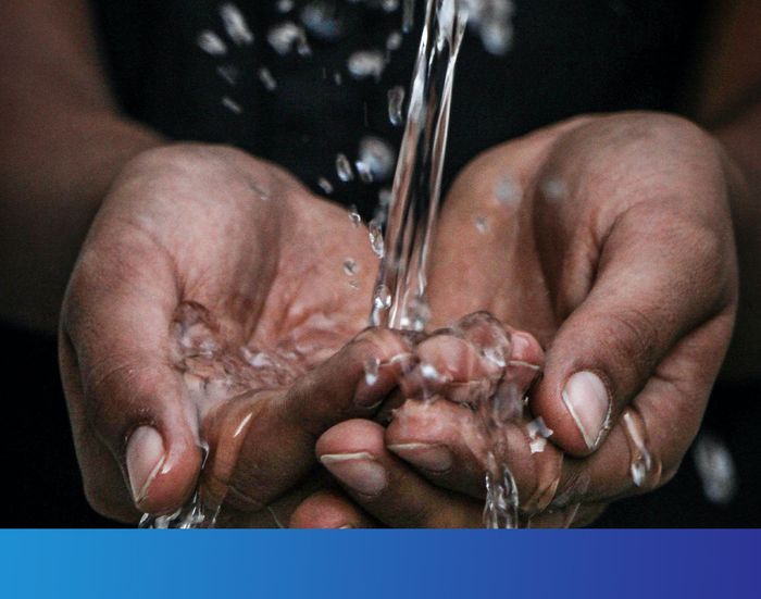 water being poured into African American hands