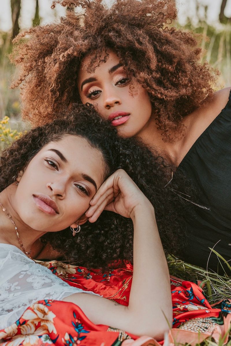 Two woman with beautiful, curly hair