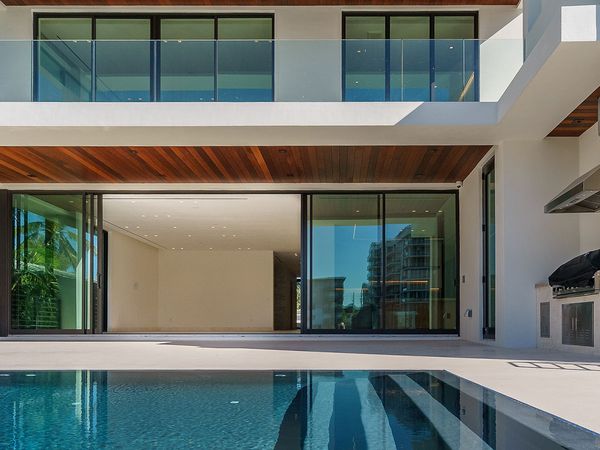 a fixed pool screen on a luxury residential home