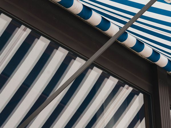 retractable awning with blue stripes