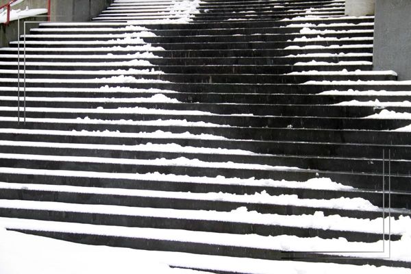 Snowy outdoor steps.