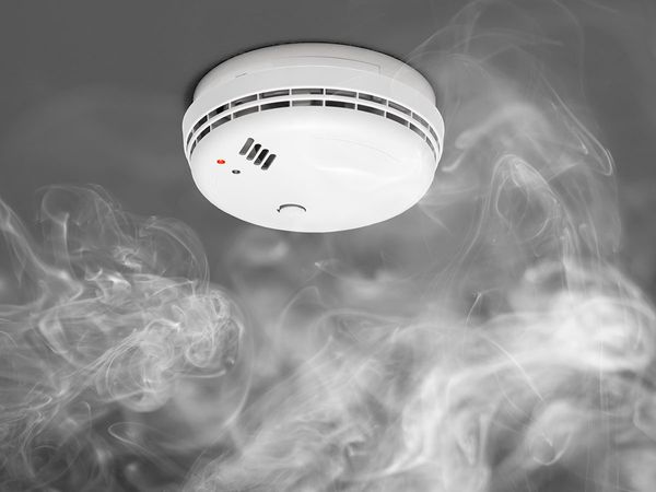 smoke rising up to smoke detector