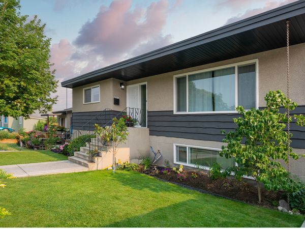  A home with a green front lawn.