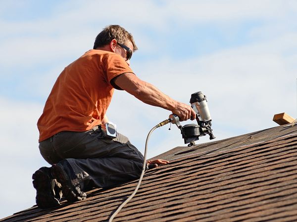 person working on roof