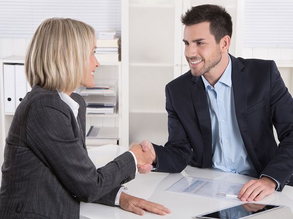 man and woman shaking hands