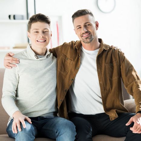 father and son smiling