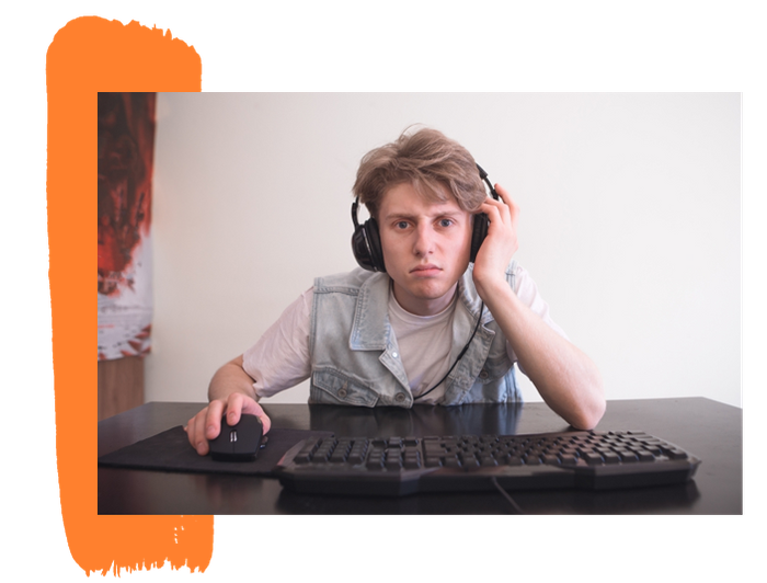 frustrated-teen-sitting-behind-a-computer-and-wearing-a-headset-mobile-6138d73dc577d.png