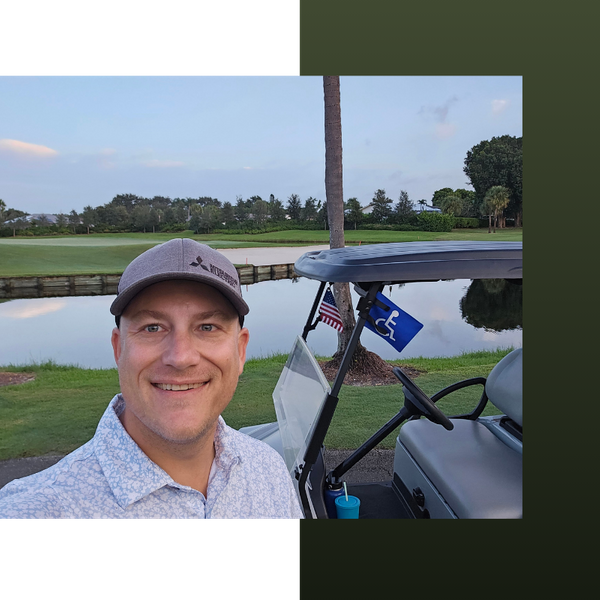 smiling man on golf course