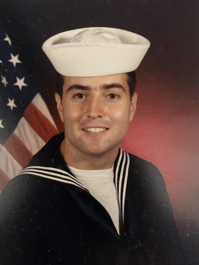 A young Ross McKendrick poses in his U.S. Navy Seabee dress uniform in front of the American flag. Originally from Australia, Ross now serves as a PGA Coach and Warrior Golf Academy Board Member, dedicated to advancing adaptive golf and veteran-focused instruction. Ross McKendrick Navy Seabee Portrait | Warrior Golf Academy Board Member