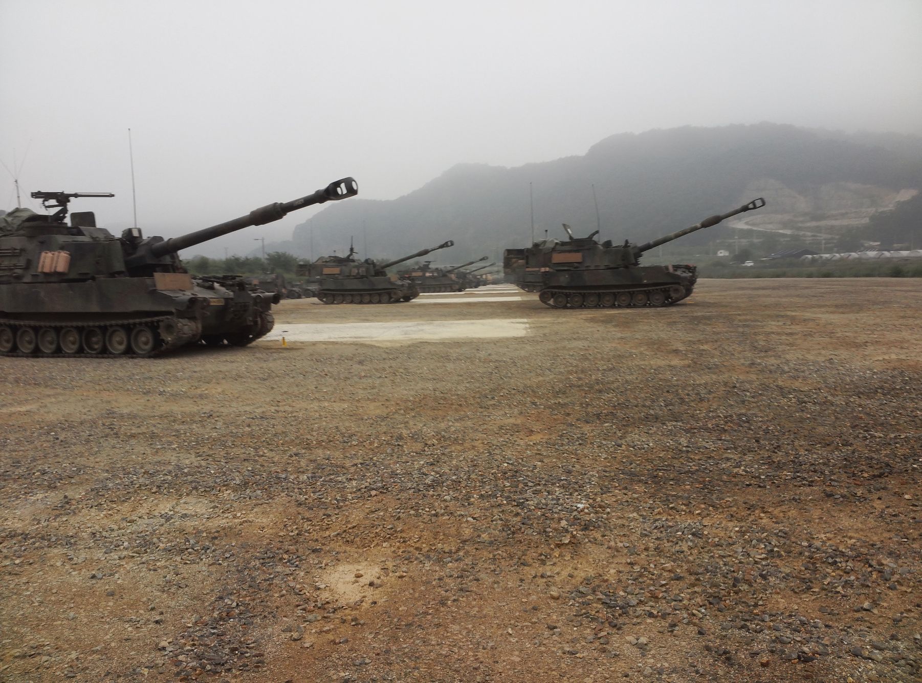 A wide-angle shot of a military battery in a desert training environment. This photo establishes the authentic Veteran-led foundation of Warrior Golf Academy, bridging the gap between field-service discipline and the focused, therapeutic nature of the golf course. WGA Military Field Operations Background