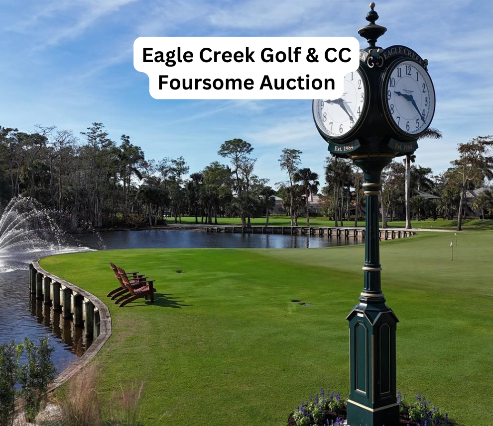 A pristine golf course setting at Eagle Creek Golf & Country Club featuring a manicured green lawn alongside a water hazard with an active fountain spray. Two wooden Adirondack chairs sit near the water's edge. In the foreground stands a prominent, vintage-style dark green street clock with gold accents. A white text overlay at the top reads "Eagle Creek Golf & CC Foursome Auction". Eagle Creek Golf and Country Club Foursome Auction Green and Clock View