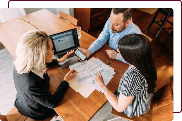 business people looking over documents