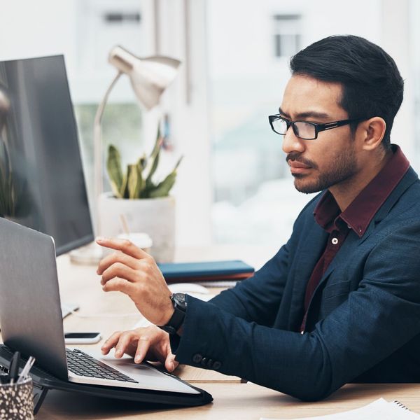 Business owner looking at computer 