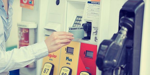 Using a credit card at a gas pump