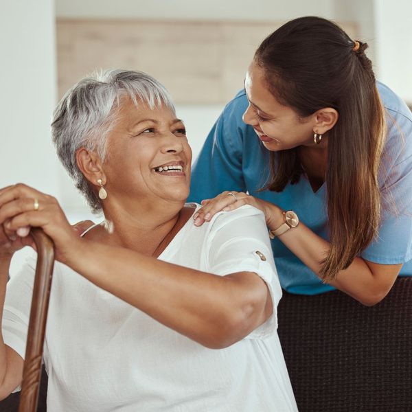 caregiver and senior sharing a happy moment