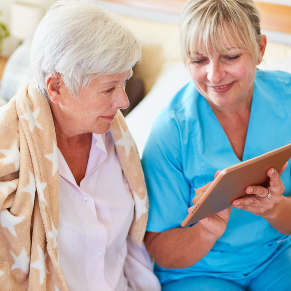 women looking at tablet together