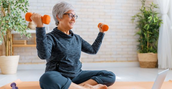 A senior aged woman doing exercises