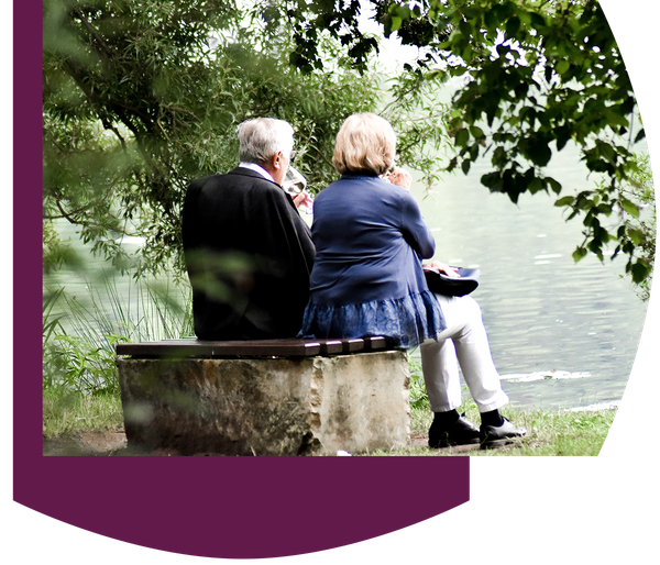 image of seniors sitting together at a pond. 