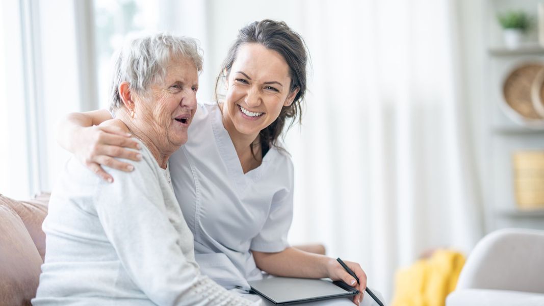 caregiver with elderly woman