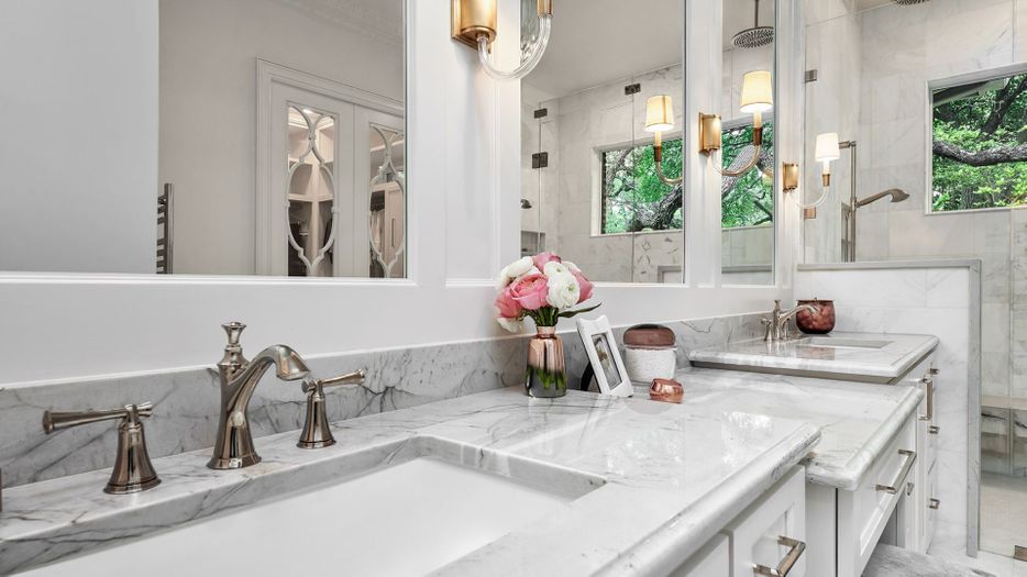 bathroom counter with pink and white flowers on it