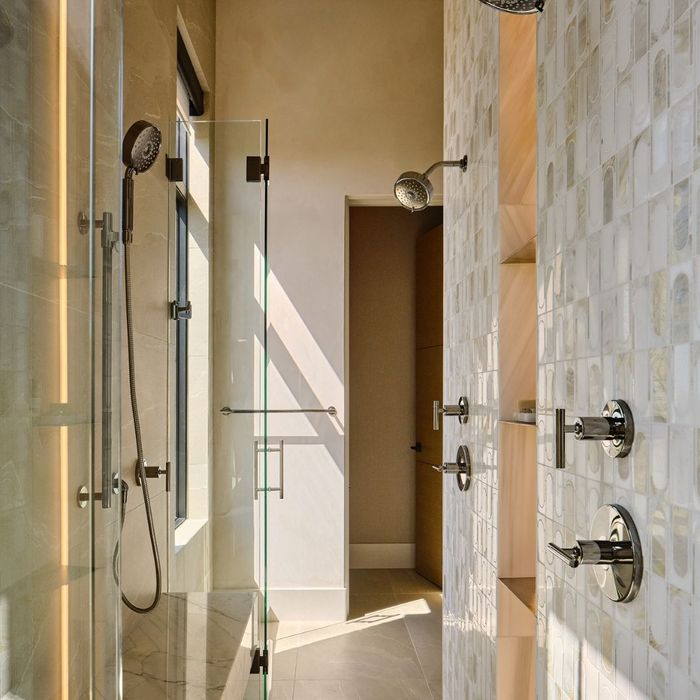 large modern walk in shower with dual shower heads