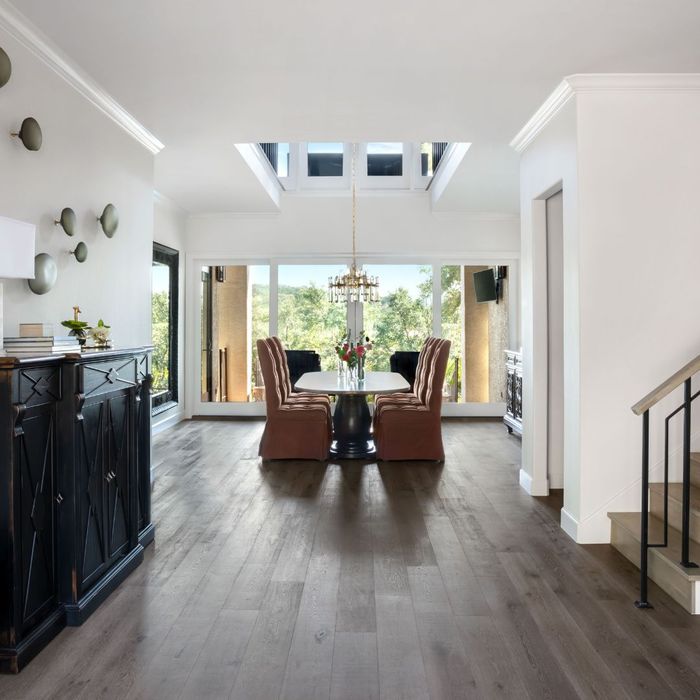 hallway with stairs and table at the end