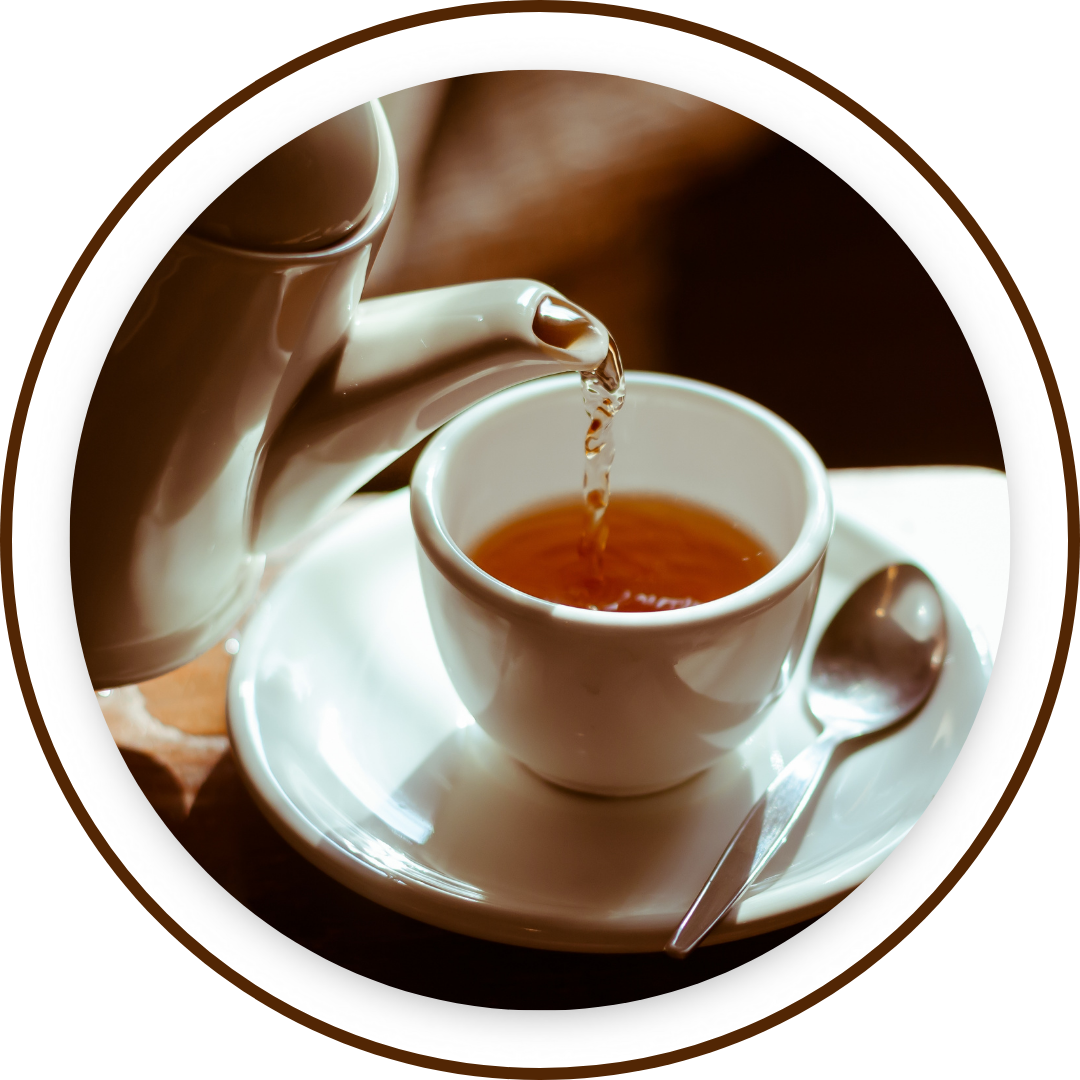 pouring tea into cup on saucer