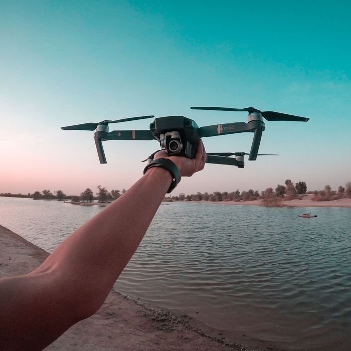 Person Holding a Drone Mastering Aerial Photography with DJI Drones 2.jpg