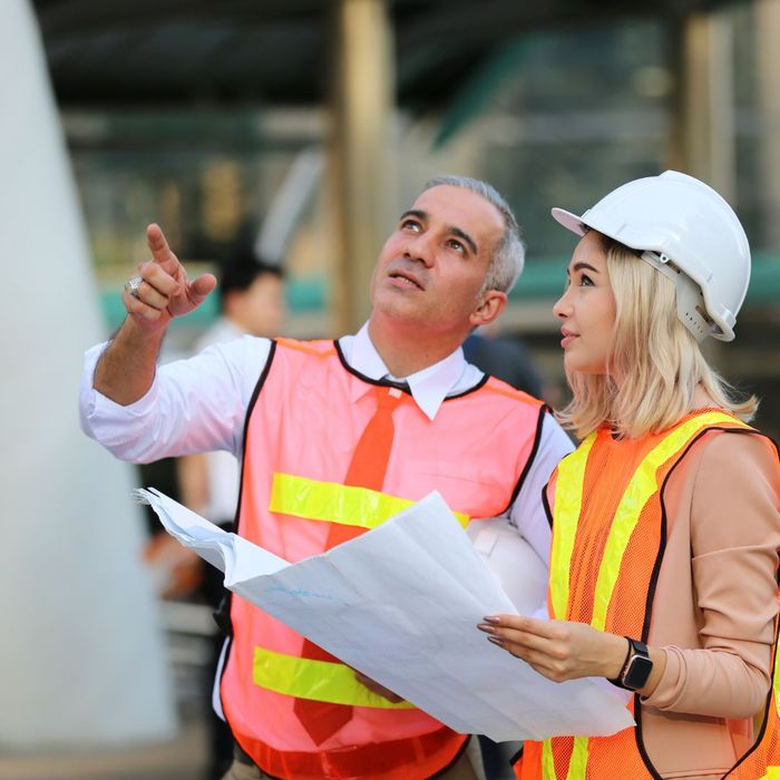 team members with construciton vests on