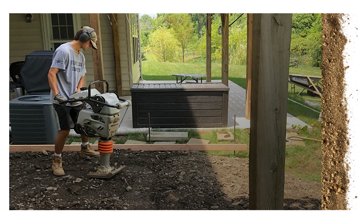 young worker using leveling machine