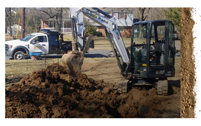 Backhoe excavator in residential neighborhood