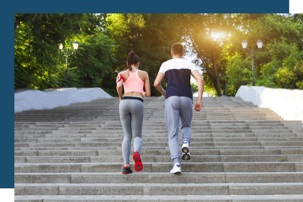 2 active people running up stairs outdoors