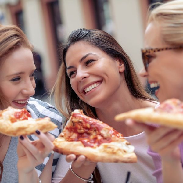 Women Enjoying Pizza 