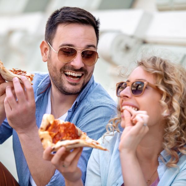 Couple Enjoying Pizza 