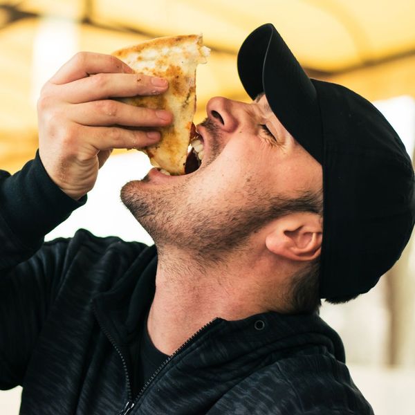 Man Eating Pizza 