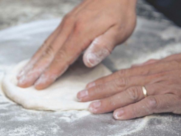 rolling pizza dough