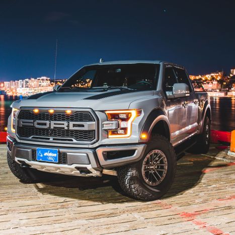 gray ford truck lit up at night